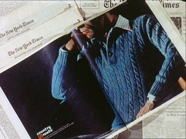 A cutting from the New York Times, showing a man in a blue jumper