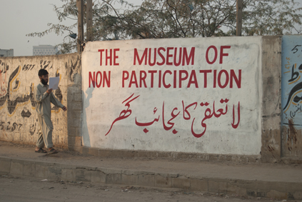The Museum of Non Participation written on a wall in English and Arabic 