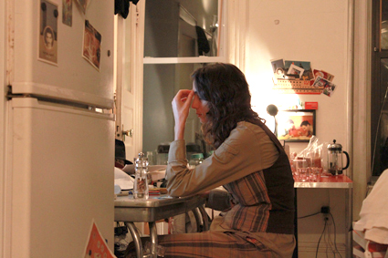 Ayreen Anastas seated at a kitchen table in the evening