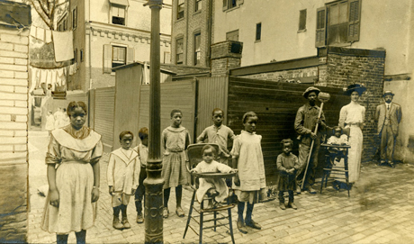 An old photograph of a group looking direct to camera 