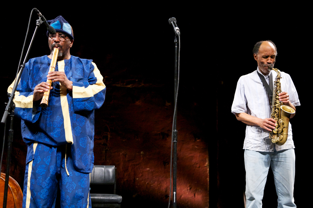 Daniel Carter plays a saxophone and William Parker plays a bamboo flute