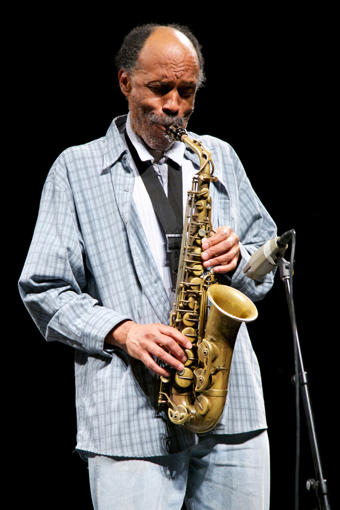 A close up of Daniel Carter playing an alto saxophone 