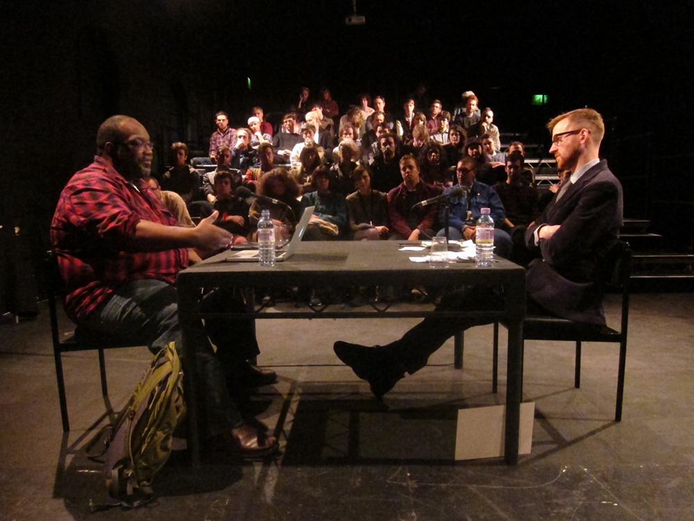 Fred Moten and Barry Esson sit across form each other as they discuss