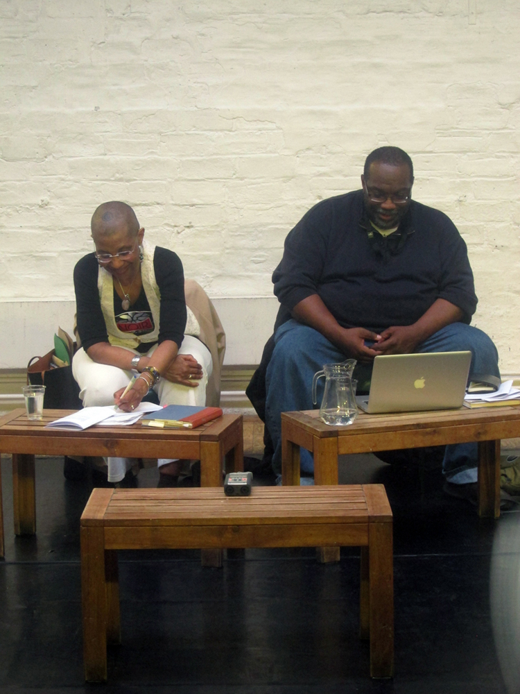 M. NourbSe Philips and Fred Moten sit next to each other during the talk