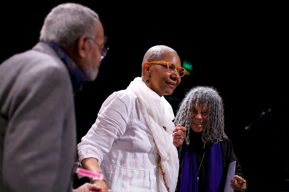 M NourbeSe Philip is congratulated by Amiri Baraka and Sonia Sanchez