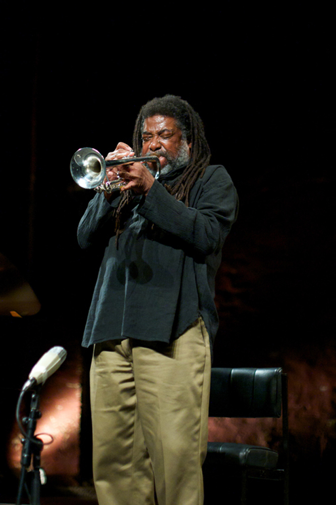 Wadada Leo Smith leans back and scrunches his eyes as he plays trumpet
