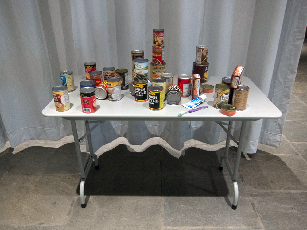 A table with various cans and jars of food