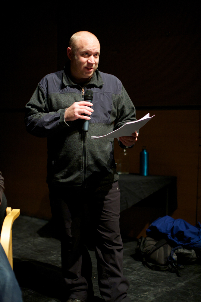 Leigh French holds a mic during the discussion