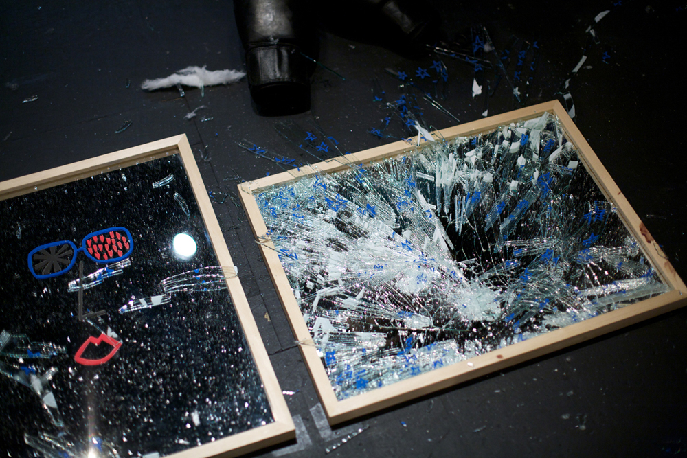 Two smashed mirrors with shards of glass here and there