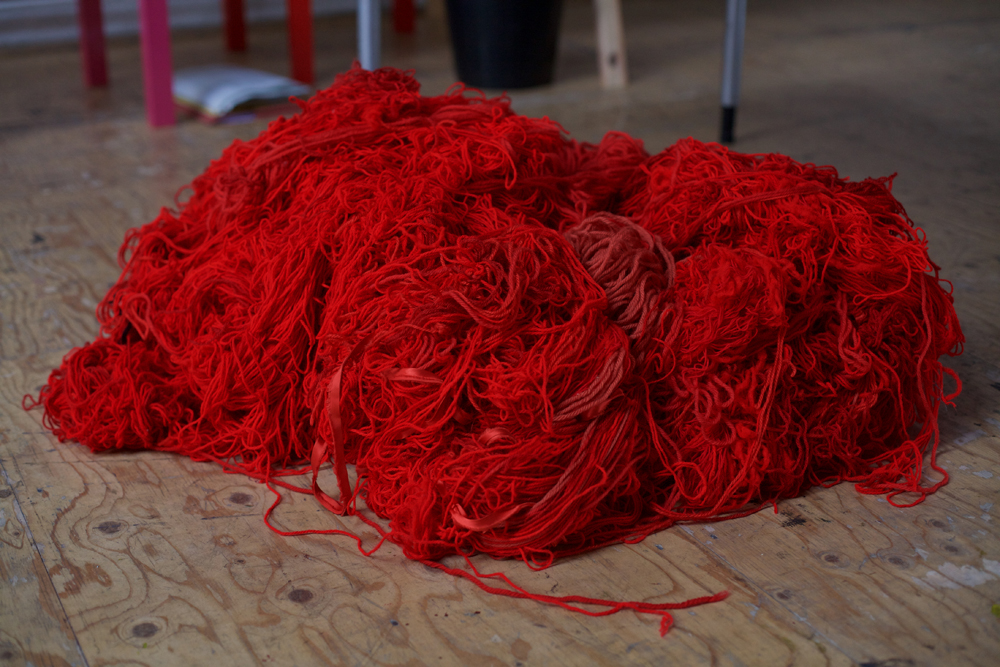 A huge pile of red wool