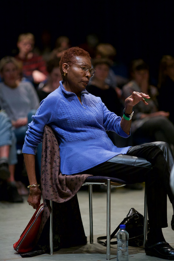 Hortense Spillers in blue and leather relaxes as she talks
