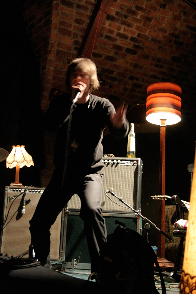 Richard Youngs stamps his foot and gesticulates as he sings energetically