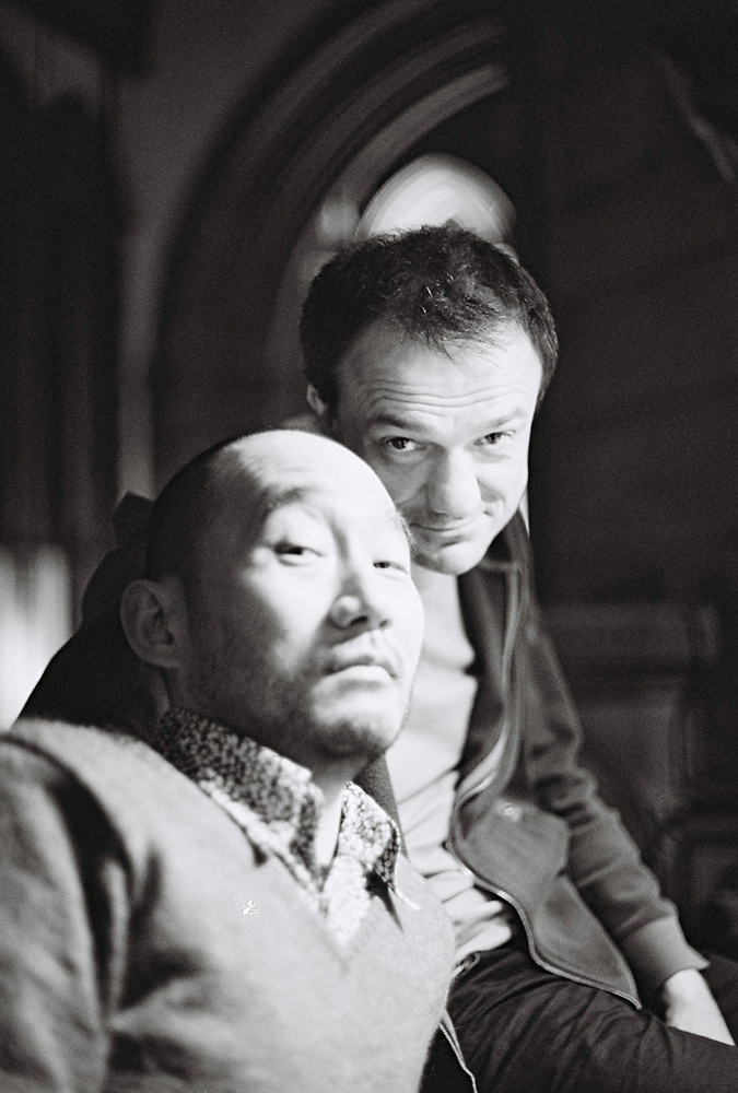 Jean-Luc and Toshi sitting near an organ