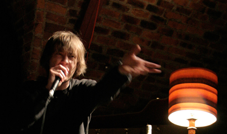 Richard Youngs stamps his foot and gesticulates as he sings energetically