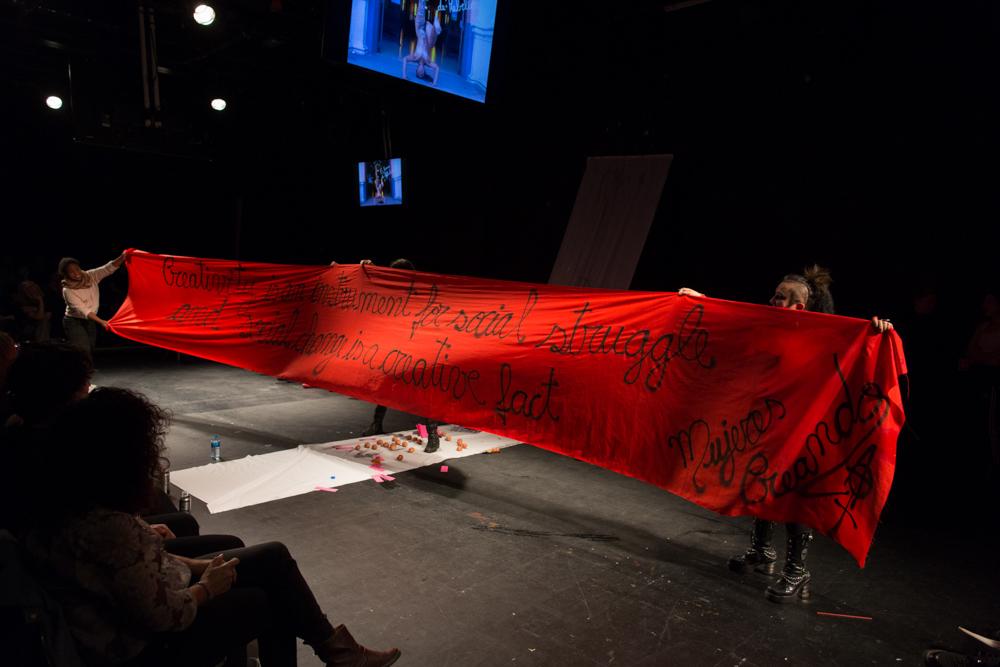 Mujeres Creando red banner says creativity is an instrument for social struggle