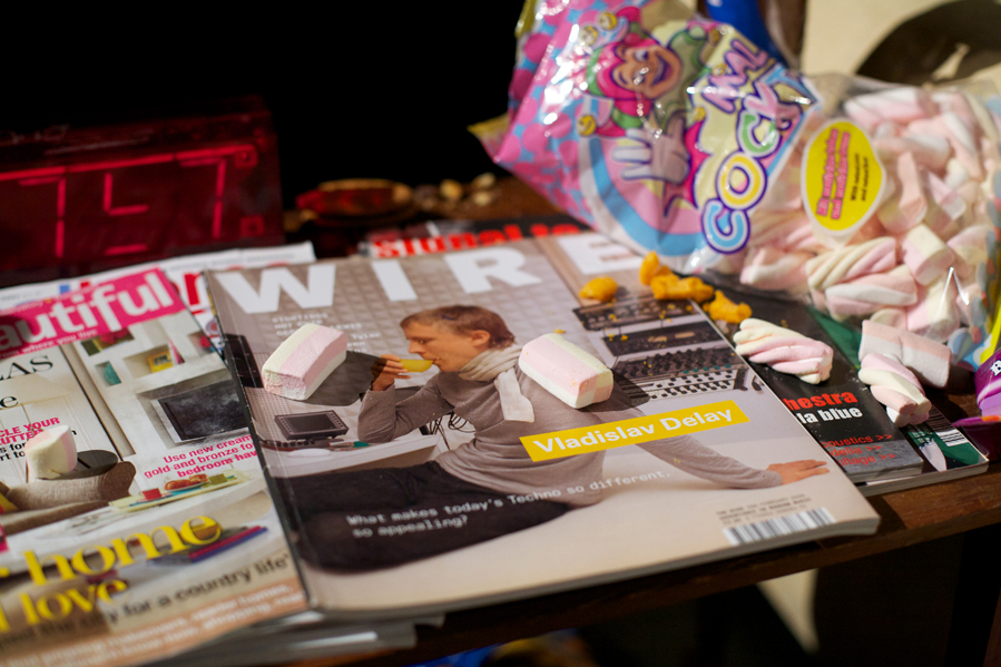 A close up of 2 magazine covers with flump sweets strewn across them