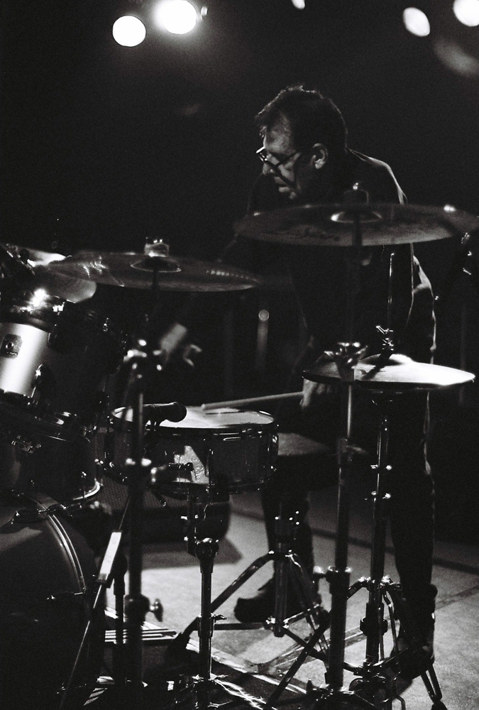 Tom Bruno standing at a drum kit