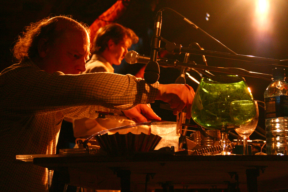 The Bohman Brothers on stage at INSTAL 06 surrounded by objects and microphones