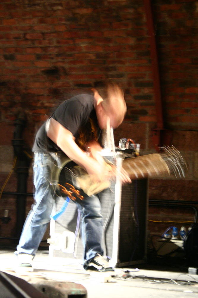 A guitarists movements blur the image
