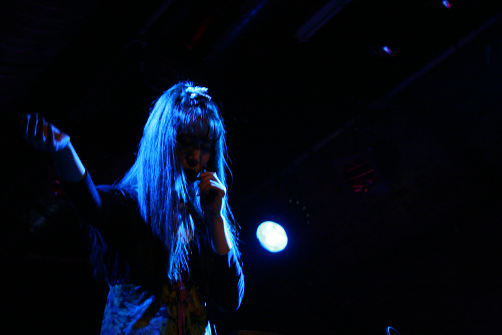 Sachiko performing in blue light at INSTAL 06