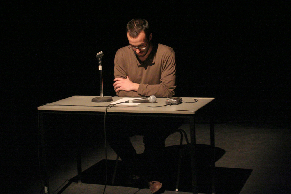 Loic Blairon Sits at a table