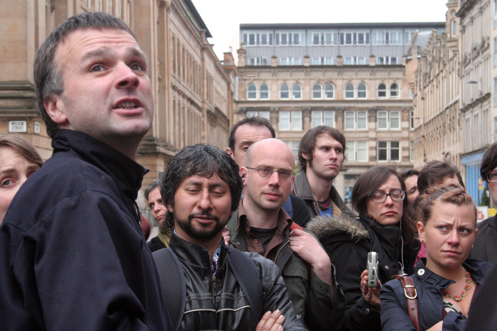 Neil Gray talks about gentrification in Glasgow surrounded by people