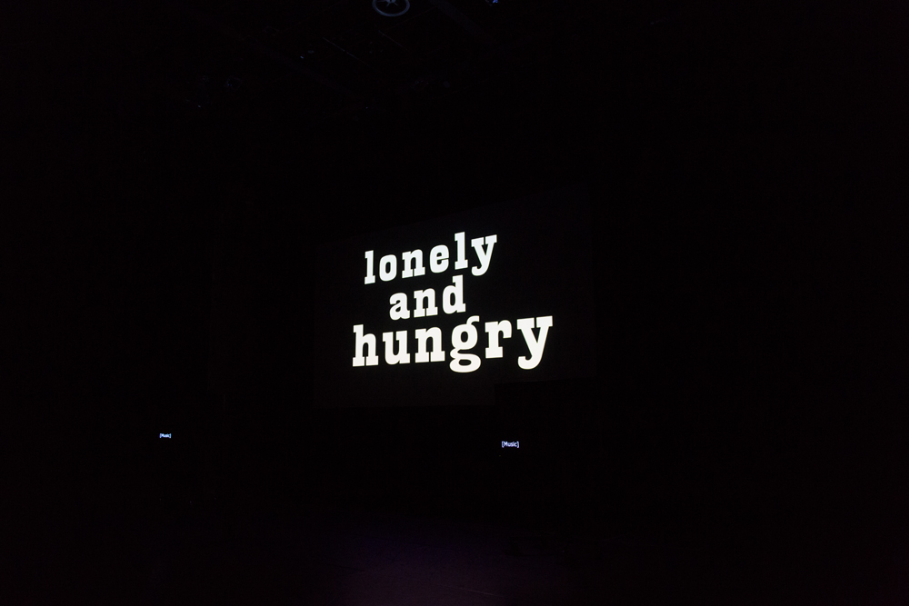 The words 'Lonely and Hungry' small and white in a black background