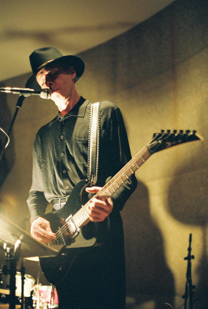 Jandek with pointy metal style guitar at Issue Project Room