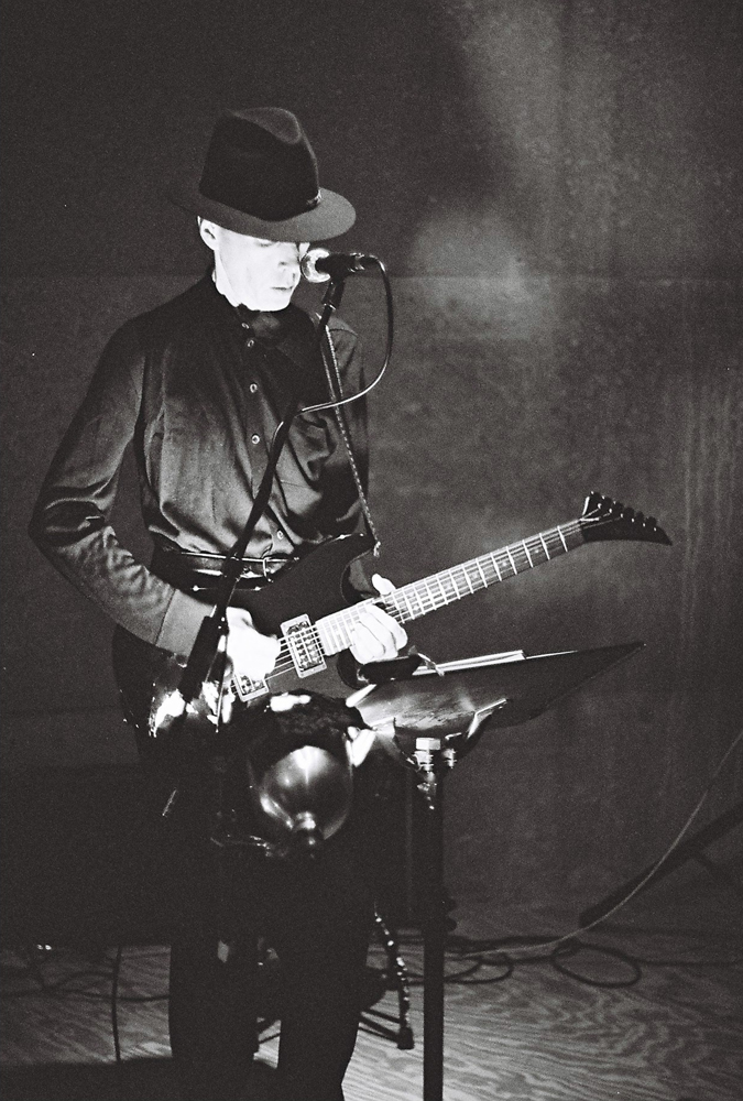 Jandek playing a guitar at Issue Project Room