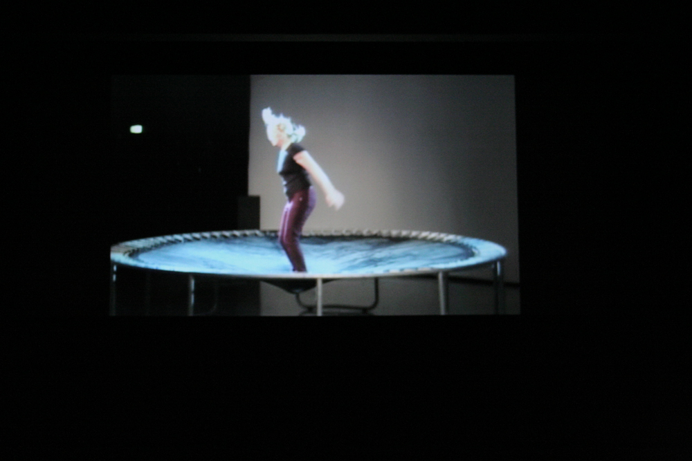 Shot of the projection of Aileen's performance in the same space