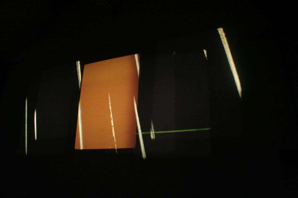 Projection of an orange rectangle along with shards of light