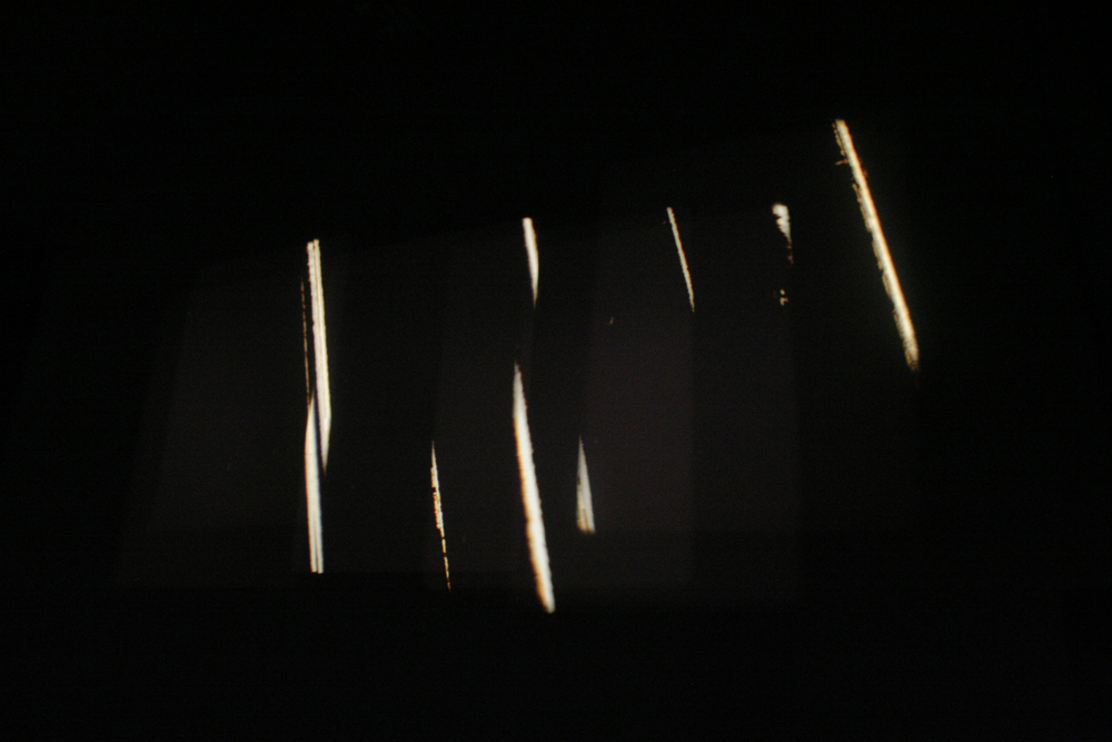 Shards of light on a black background from Sound Cuts projection