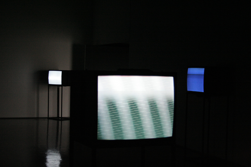 Cathode Ray Monitors showing abstract images in a gallery