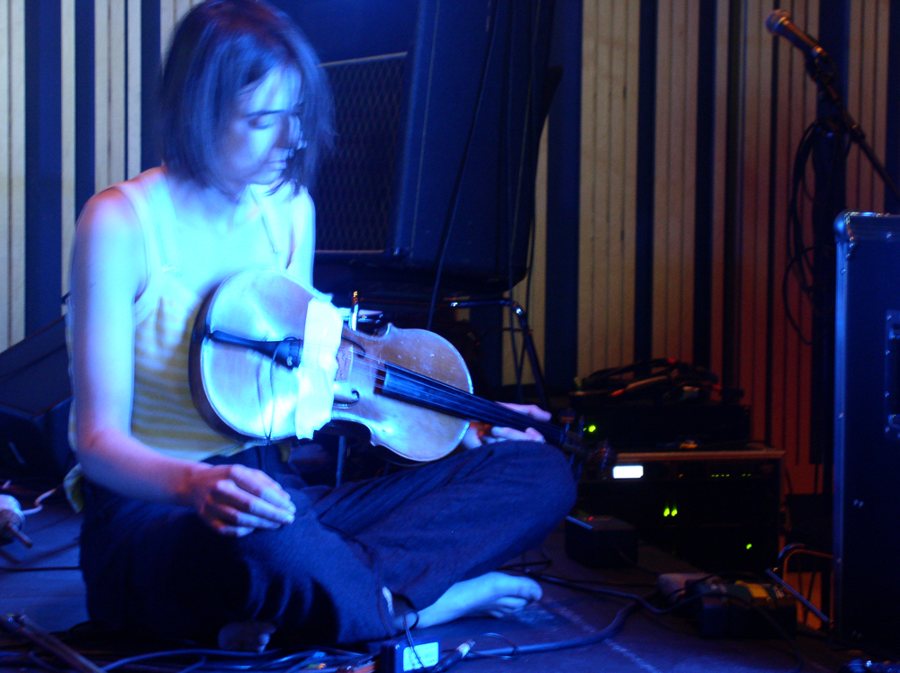 Bridget Hayden playing a violin with Vibracathedral Orchestra