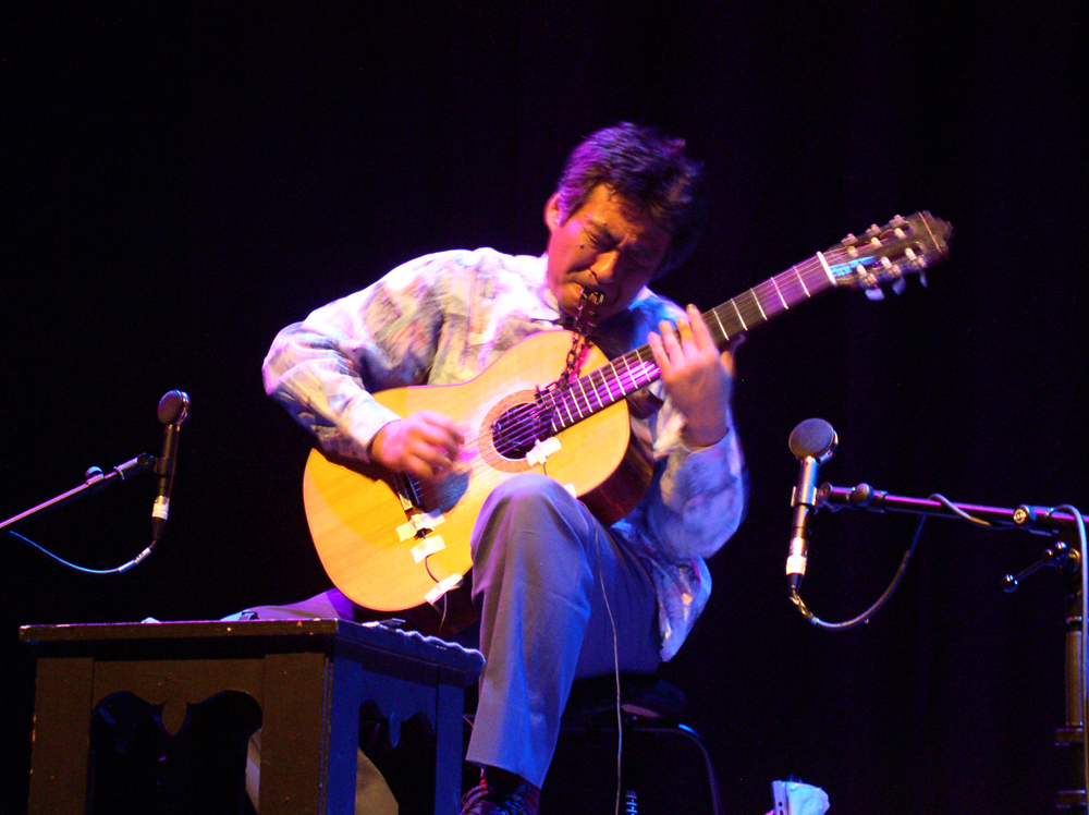 acoustic guitar player on stage