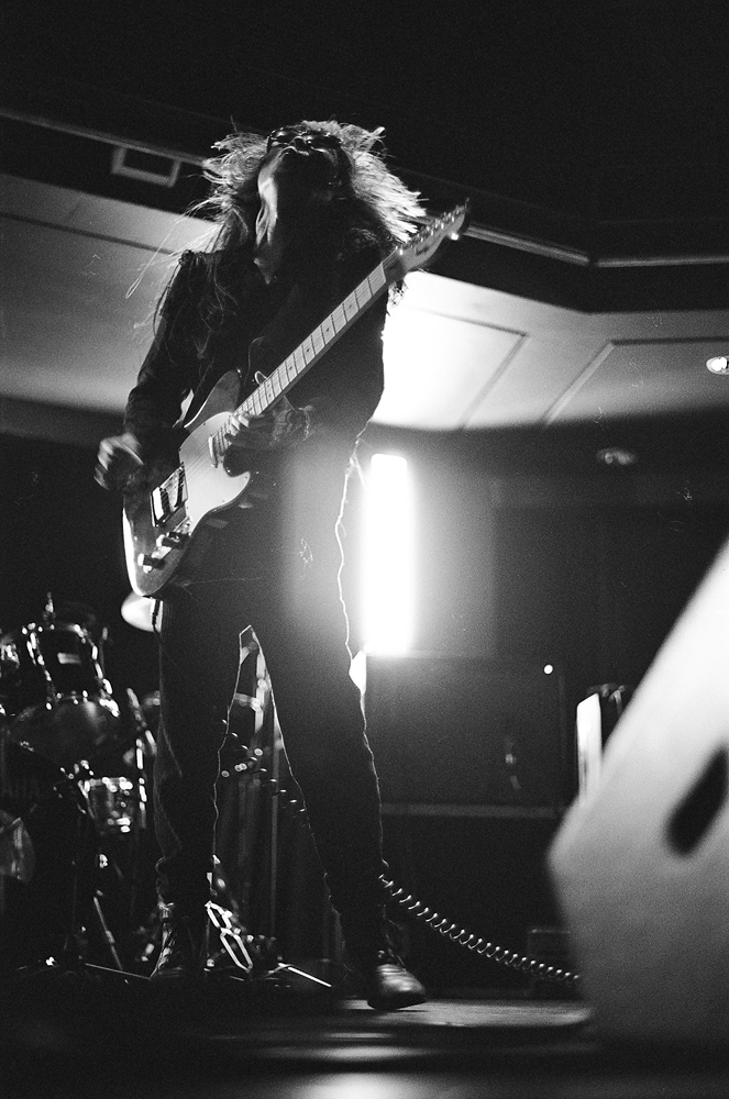 Keiji Haino playing an electric guitar with head thrown back at MLFC 05