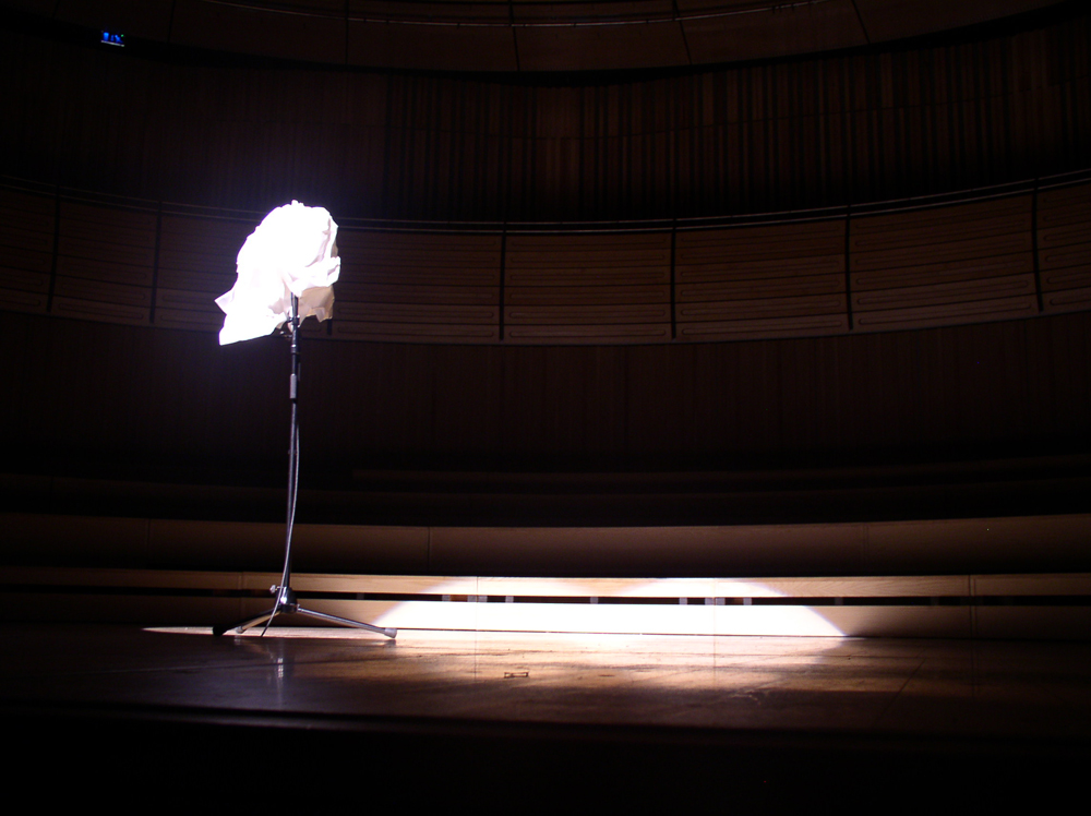 The microphone wrapped in paper along on the stage