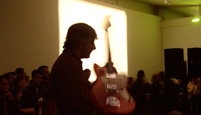 Lee Ranaldo holding a guitar at DCA Dundee