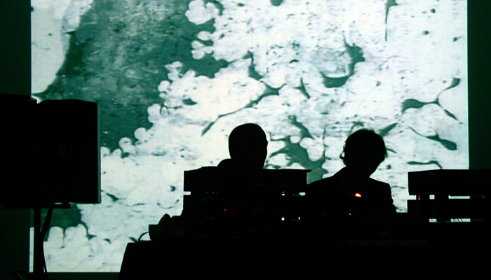 Mirror performing in front of a projection at KYTN 04