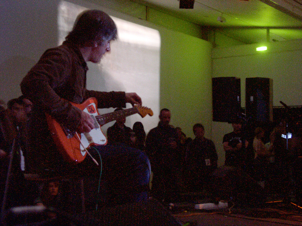 Lee Ranaldo tuning a guitar at DCA Dundee