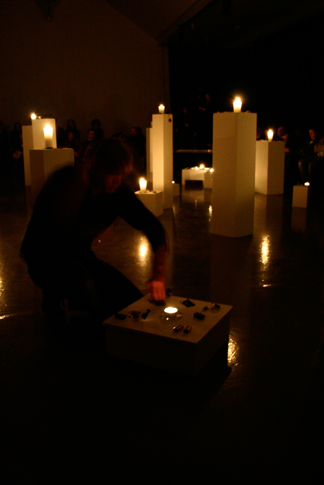 Candles on plinths in a Joe Colley performance 