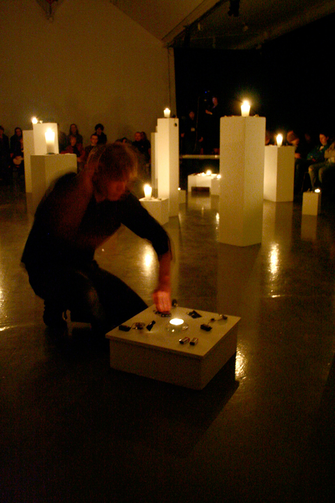 Joe kneeling by a plinth working with one of the candles