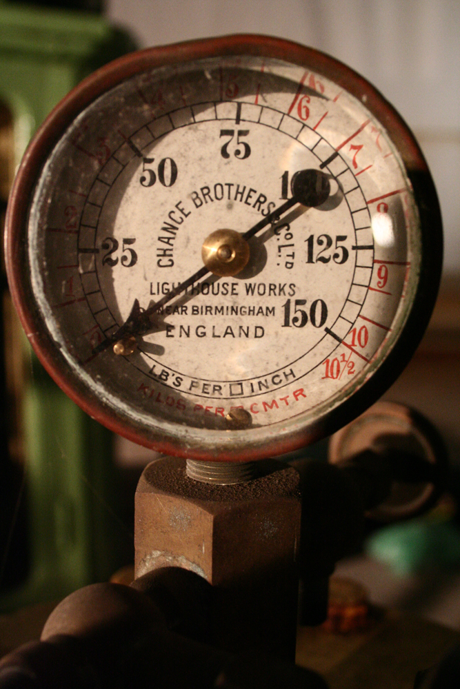 An old pressure gauge with imperial and metric measurements