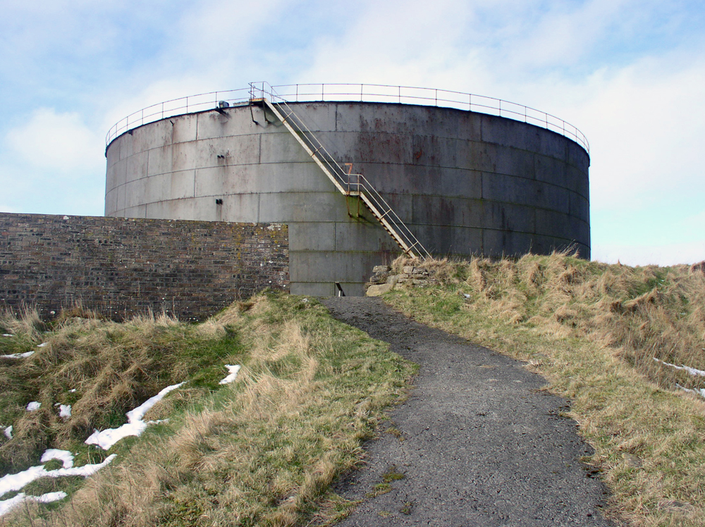 path towards Lyness Oil Tank with grass and snow on either side