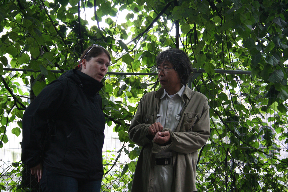 Bryony and Tamio looking wistful near a tree