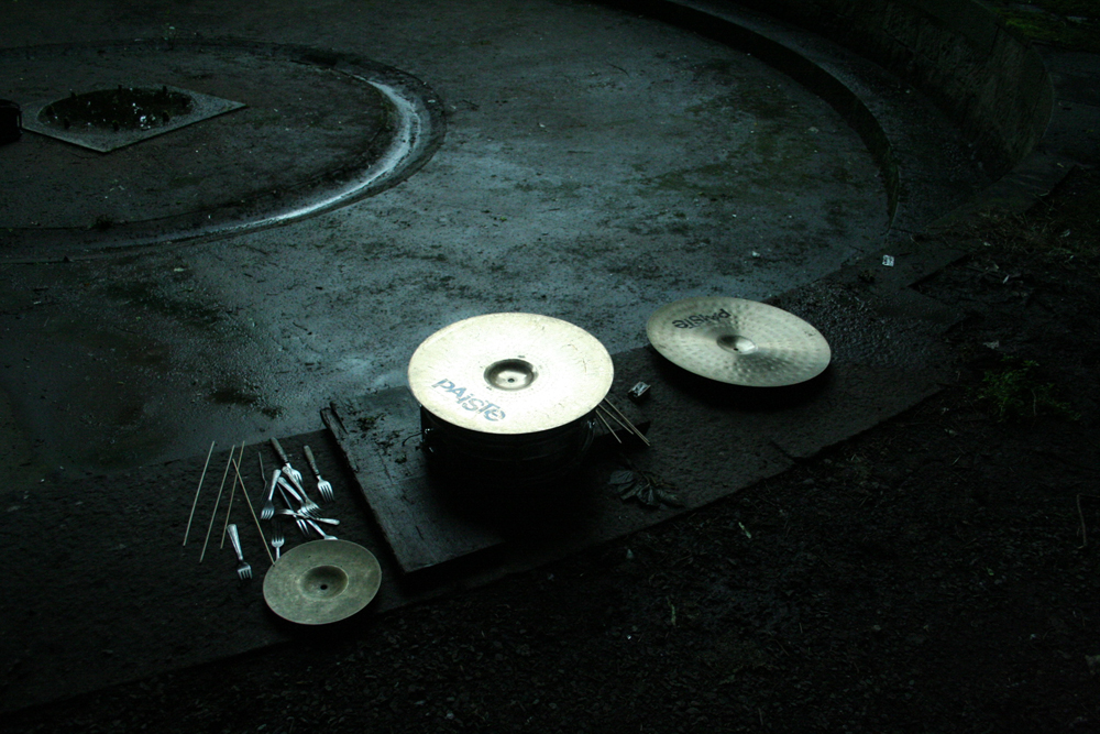 Sean's forks, cymbals, sticks etc on a stone floor