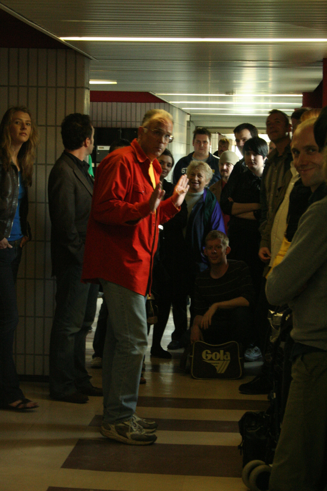Denis Wood talking to an audience indoors