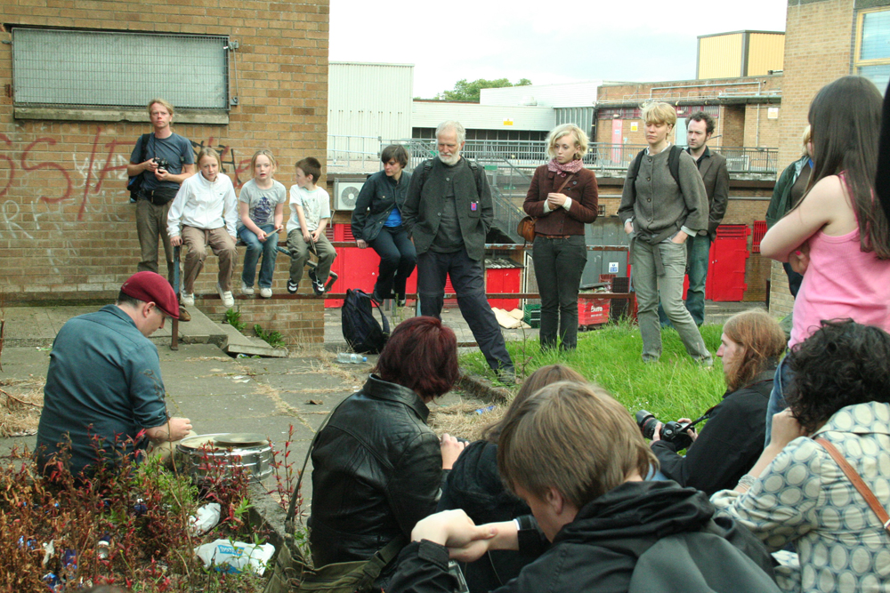 Sean Meehan surrounded by audience in Easterhouse