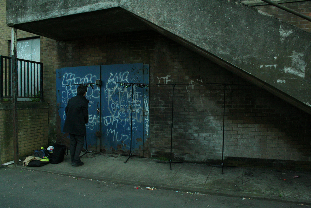 Ikuru Takehashi performing in a back corner of Easterhouse