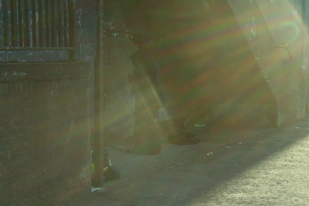 Ikuru Takehashi performing in a back corner of Easterhouse at dusk